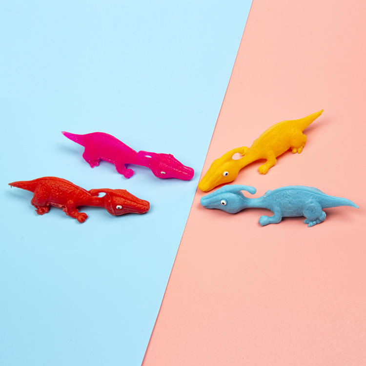 Wholesale custom soft TPR dinosaur catapult finger flinging funny toys for children