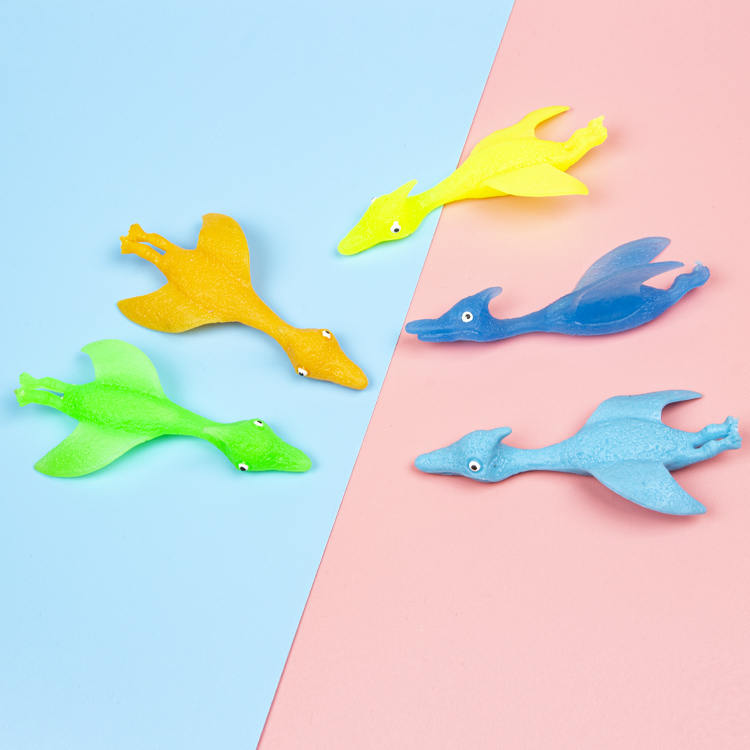 Wholesale custom soft TPR 4 color pterosaur catapult finger flinging funny toys for children